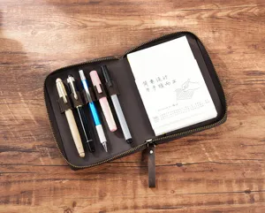A6 leather zipper notebook cover with pen holders and notebook insert, vintage brown planner.