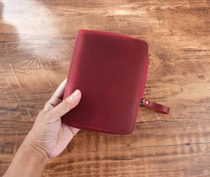 Detail shot of the A6 leather zipper notebook cover showing fine grain texture and stitching.