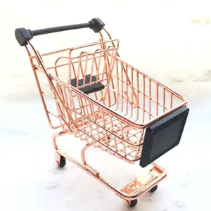 Detail view of the mini rose gold shopping cart, perfect desktop organizer and cute decor.