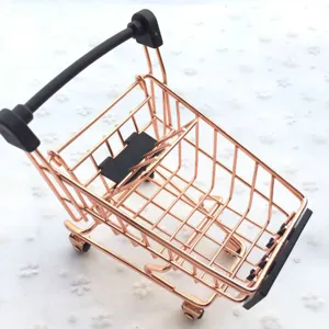 Mini rose gold metal shopping cart detail, cute desktop storage prop and miniature toy.