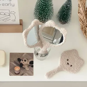 Cute fluffy bear handheld makeup mirror with soft plush trim and adorable embroidered face details.