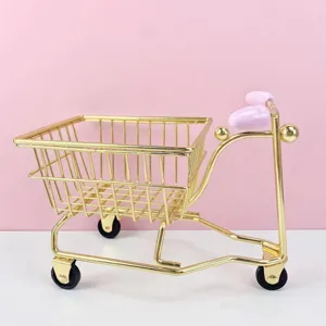 Mini metal shopping cart desktop organizer with cute pink handle, perfect for office storage.
