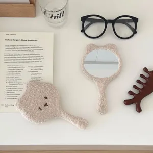 Cute fluffy bear handheld mirror, soft plush vanity makeup mirror with adorable cartoon design.