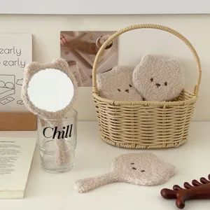 Cute fluffy bear handheld makeup mirror with soft plush fleece finish for daily desktop use.