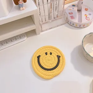 Cute cartoon smiley face woven cotton coaster, yellow thermal insulation cup mat for desk decor.