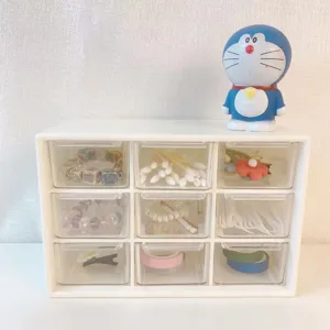 Desktop 9-grid storage box with transparent drawers, perfect for keeping small items organized.