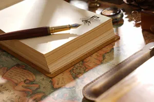 Handmade vintage leather notebook sketch journal with a fountain pen for daily writing.