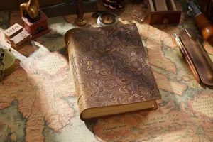 Vintage genuine leather journal notebook with embossed floral pattern for daily writing and sketching.