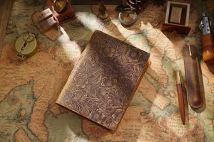 Vintage genuine leather embossed notebook journal, handmade retro sketch book, detailed view.