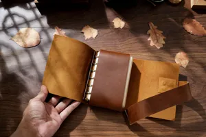 Handmade genuine leather A6 loose-leaf vintage notebook journal featuring metal rings.