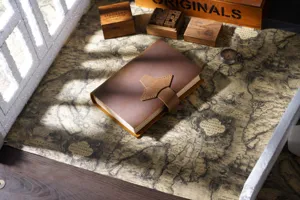 Handmade genuine leather notebook closeup, vintage diary journal with strap closure detail.