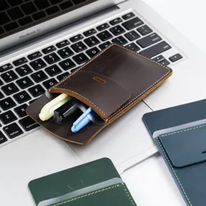 Leather pocket protector detail showing pen pouch design, portable nurse doctor pen holder.