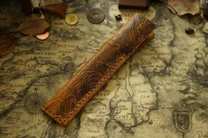 Vintage embossed leather pen sleeve detail, handcrafted genuine cowhide tea knife case.