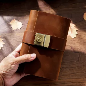 Handmade genuine leather A6 vintage journal notebook with retro brass combination lock.