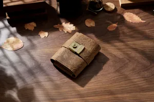 Vintage leather journal with combination lock, embossed traveler notebook for sketching and diary.