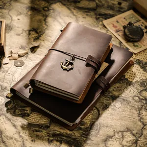 Vintage leather travel notebook set with anchor charm, handmade journal for daily writing.