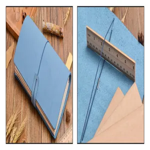 Taccuino diario in pelle blu con banda elastica e inserto in carta kraft per la pianificazione.