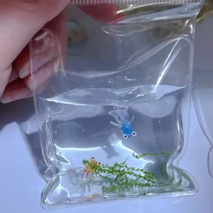 Close-up of cute goldfish squeeze toy in clear water bag, fun decompression stress relief item.