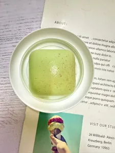 Green mini toast squishy toy detail view, soft slow rising decompression stress relief item.