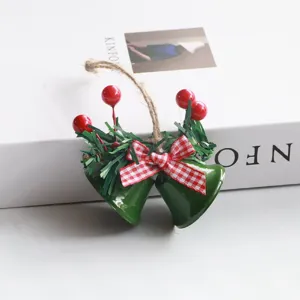 Christmas double bell hanging decoration with red berries pine needles and checkered bow for tree