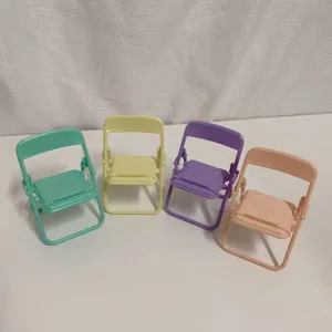 Mini folding chair phone stand macaron colors cute desktop decor detail view of four stands.
