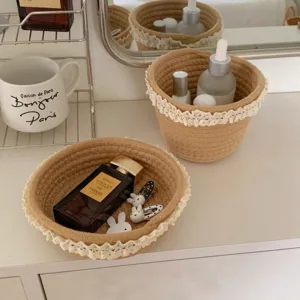 Woven storage basket with delicate lace trim, perfect for desktop cosmetic and sundries organization.