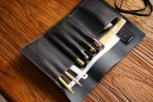 Genuine leather roll-up pencil case vintage retro stationery storage bag detail view for office.