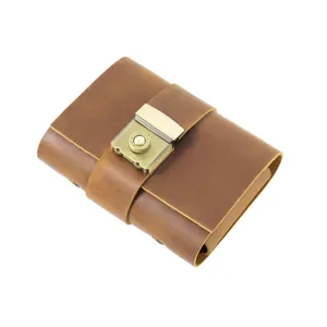 Vintage brown leather A7 journal notebook with combination lock for daily writing and sketches.