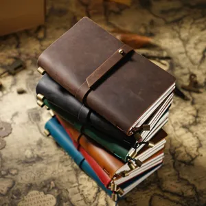 Agenda journal vintage en cuir avec lanière, carnet de notes artisanal en cuir de vachette coloré.
