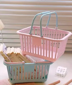 Plastic desktop storage basket detail, cute pink and blue handheld organizer for stationery.
