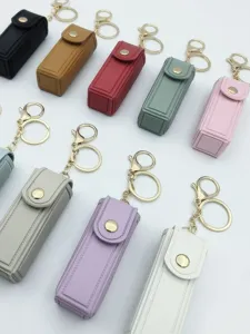 Portable PU leather lipstick case keychain with metal snap closure multi-color design.