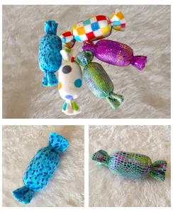 Plush squeaky candy dog chew toy detail, soft pet teething toy with colorful patterned design.