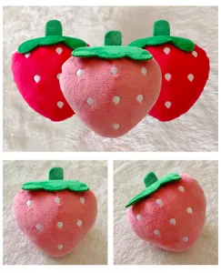 Cute strawberry plush pet toy for dogs, soft squeaky chew toy detail view showing cute design.
