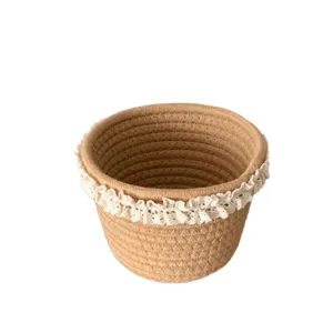 Close-up detail of a woven storage basket with delicate white lace trim, perfect for desktop organization.