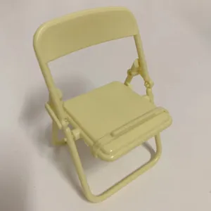 Mini folding chair phone stand desktop cute holder for smartphone wireless earphones yellow