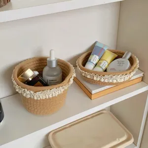 Close-up of woven storage basket with delicate lace trim, ideal for desktop cosmetic setup.