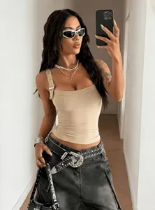 Detailed view of women's beige ribbed adjustable strap tank top, stylish street wear.