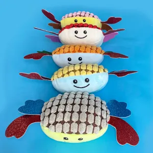 Gioco in peluche cigolante per cani, morbido giocattolo da dentizione con ali glitterate colorate.
