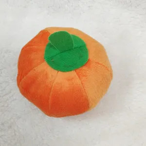 Plush pumpkin dog toy, soft chew and squeaker toy for small dogs and puppies, fun pet supply.