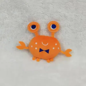 Cute crab shape squeaky plush dog toy, soft material for teething and biting pet fun.