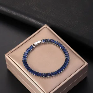 Close-up of AAA blue zircon bracelet with rectangular stones on a beige gift box