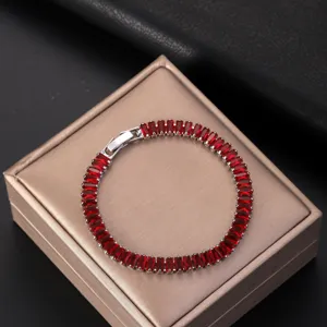 Close-up of AAA red zircon bracelet with elegant rectangular stones on jewelry box