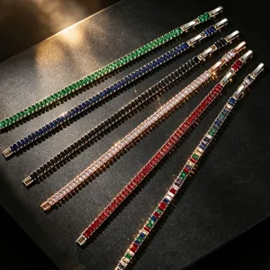 Elegant AAA cubic zirconia bracelets in various colors arranged on a black surface.