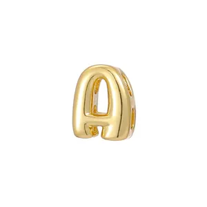 Detailed close-up of a polished golden bubble-shaped letter A charm for DIY jewelry