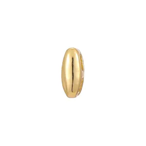 Detail shot of a polished gold bubble jewelry accessory for DIY necklaces.