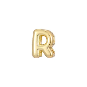 Detailed view of a glossy 3D bubble-style golden letter R pendant for DIY jewelry making