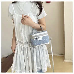 Stylish denim blue box handbag with rhinestone studs and silver chain strap.