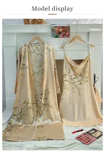Detailed view of floral satin sleepwear set featuring a long robe and camisole dress