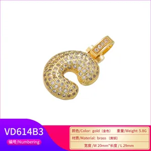 Detailed view of hip-hop gold brass pendant with micro-paved cubic zirconia letter design
