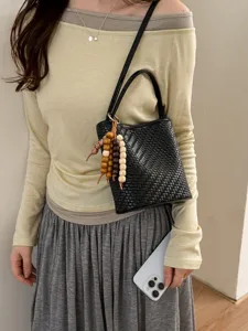 Korean style black woven texture bucket bag with wooden bead charm accessory for women